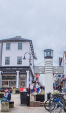 Crowds of people walking down a shopping street in Bury St Edmunds