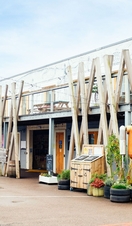 Robot sculpture outside a building with geometric décor