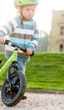 A child riding a bike outside Ashton Court in Bristol