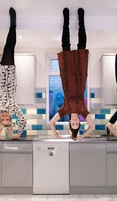 People posing in an upside down room at Liverpool's Quirky Quarter