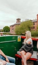 A group of people riding in a riverboat