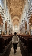 Woman walking down the aisle of a church