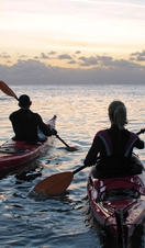 A couple kayaking off the coast of the United Kingdom