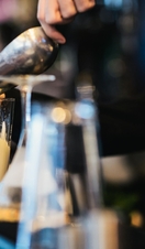 Bartender Preparing a Cocktail in a Large Glass
