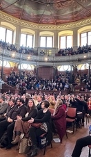 Crowds of people watching a talk on stage at Oxford Literary Festival