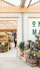 Fresh flowers and produce on sale at One Market in Brighton