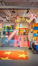 Children playing in a colourful play area