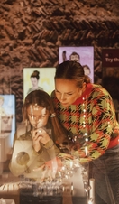 Mother and daughter looking at a display case in Colchester Castle museum
