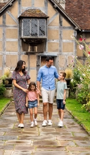 A family walking together outside heritage building