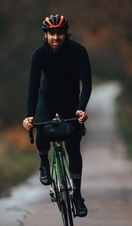 Two young cyclists riding in the Chiltern Hills during the winter.