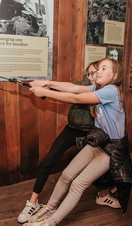 Two children playing with an exhibit at the National Emergency Services Museum in Sheffield