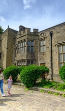 Family walking outside a heritage building