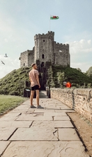 Man looking out at the castle view