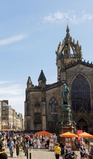 People walking on the Royal Mile on a sunny day 