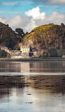 Calm lake panorama overlooking Dumbarton Castle in Scotland