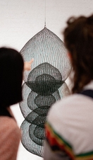 Two people looking at an art exhibit in Modern Art Oxford