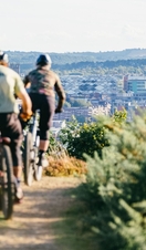 People riding bikes on the inner city mountain bike trails at Parkwood Springs, Sheffield