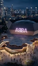 Aerial promotional image for ABBA Voyage of large venue at night with ABBA sign lit up and people at entrance
