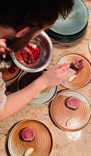 A chef plating up food in Brighton's highly rated Kindling Restaurant