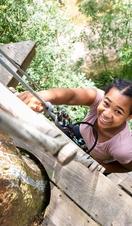 A child climbing up a tree at Go Ape Wendover
