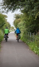 People cycling through the countryside