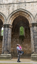 A parent and child exploring Kirkstall Abbey