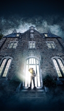 A warden with a lanturn stood in front of Bodmin Jail for a promotional shot