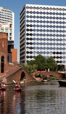 People kayaking through Gas Street Basin, Birmingham, West Midlands
