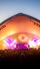 Spring Classic Festival crowd at sunset Main stage illuminated