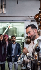 A tour group being shown around a gin distillery in Leeds