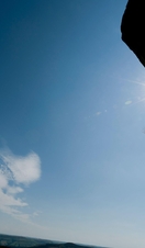 woman rappelling from cliff at Windgather rocks in the Peak District