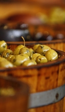 Buckets of olives on display at a market