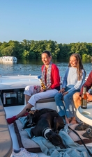 A family relaxing on a boat in the Broads