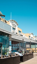 A row of shops and restaurants on Brighton's Marina
