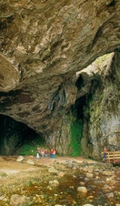 A group of people preparing to enter Smoo Cave - a large limestone cavern near the north coast of Durness
