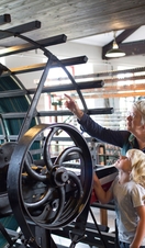 A grandparent and child looking at an industrial exhibit in Leeds Industrial Museum