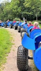 Children being driven around Bowland Wild Boar Park on a land train
