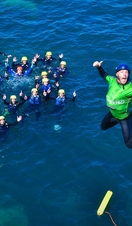 A man diving into the sea off the coast of Cornwall