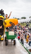Performers on stage at York Maze shooting foam from a cannon