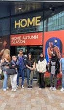 A group of people on a music themed tour of Manchester