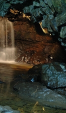 A waterfall cascade inside ingleborough cave in yorkshire, england
