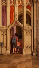 A woman and child exploring the interior of Norwich Cathedral