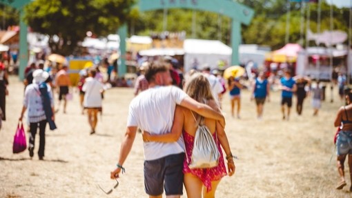 A couple walking at the Isle of Wight Festival