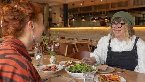 Two women enjoy lunch in a restaurant