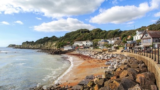 Coastline with sand and houses at Steephill Cove, Ventnor, Isle of Wight