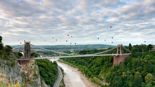 Hot air baloons floating above the Clifton Suspension Bridge in Bristol