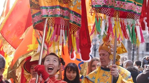Performers in colourful Chinese costumes performing