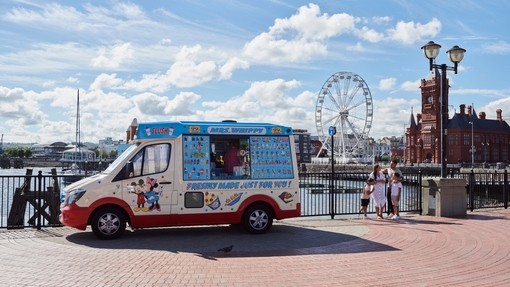 View of ice cream van and nearby family at Cardiff Bay
