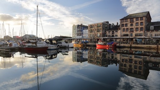 Harbour with boats and shops and cafe's at Plymouth Barbican