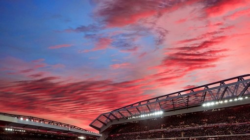 Red clouds in sunset over the ground of a stadium